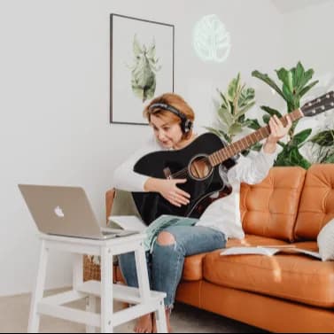 Person playing guitar